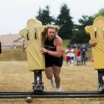 Lake Stevens linemen participate in the sled push during the Cougars Championship Lineman Challenge on July 31 in Arlington. (Olivia Vanni / The Herald)