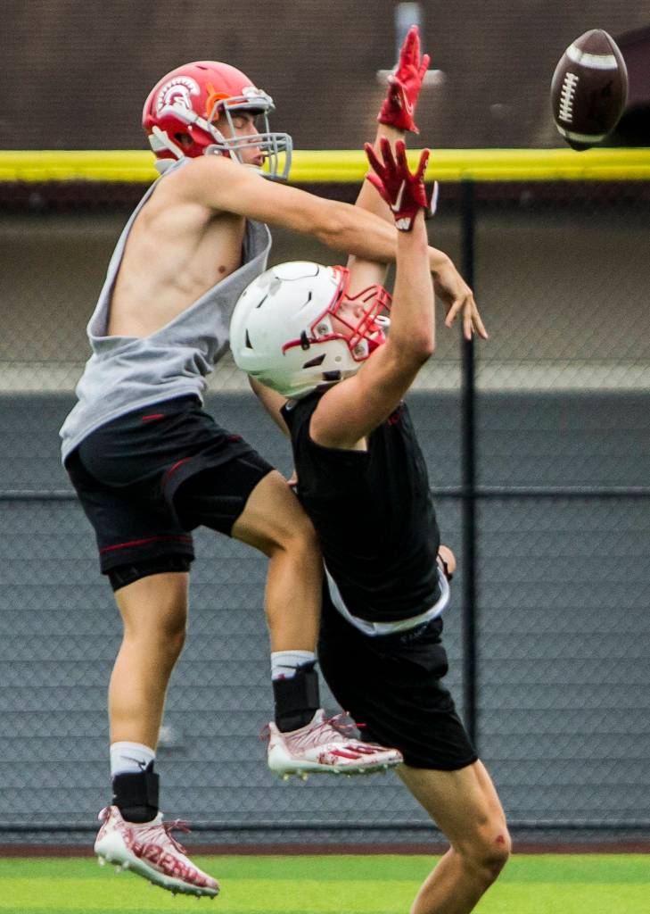 Standwoods Carson Beckt blocks a pass during the Cougars Championship Passing Tournament at Lakewood High School on July 31 in Arlington. (Olivia Vanni / The Herald)