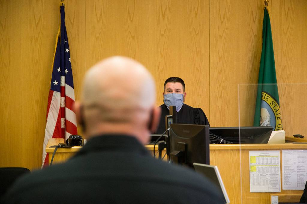 Benjamin Stum talks and thanks the staff and Everett District Court Judge Anthony Howard during mental health court, from which he graduated a year ago. (Andy Bronson / The Herald)