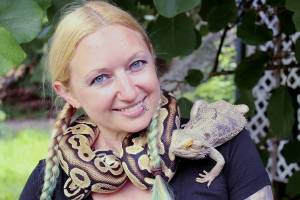 Amanda Ferrara poses with ball python Lemon and bearded dragon Drogon. (Photo by Karina Andrew/Whidbey News-Times)