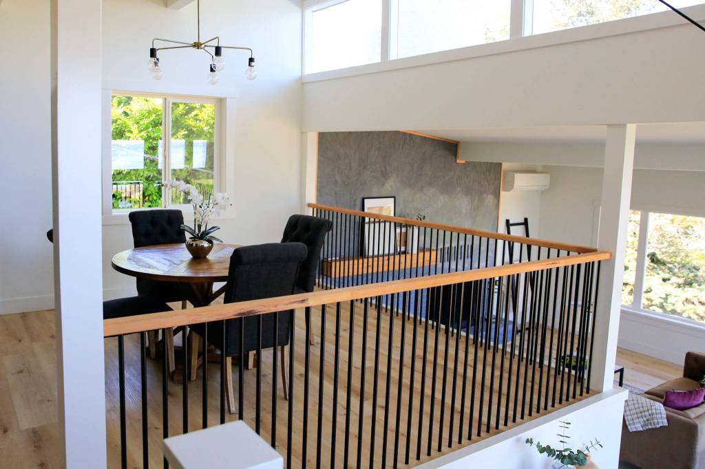 The dining and living rooms at a listing in Mukilteo. (Kevin Clark / The Herald)