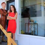Real estate agents Carole Falleen and Randi Szakaly at their listing Wednesday morning in Mukilteo on July 28, 2021.  (Kevin Clark / The Herald)