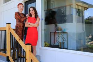 Real estate agents Carole Falleen and Randi Szakaly at their listing Wednesday morning in Mukilteo on July 28, 2021.  (Kevin Clark / The Herald)