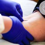 JaNeen Aagaard donates blood at Bloodworks Northwest on Friday in Everett. (Kevin Clark / The Herald)