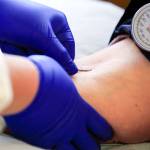 JaNeen Aagaard donates blood at Bloodworks NW Friday afternoon in Everett at July 30, 2021.  (Kevin Clark / The Herald)