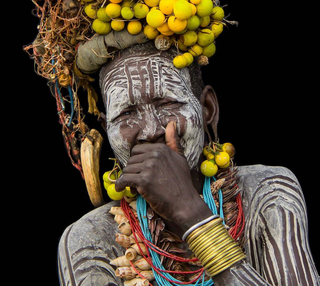 Full Regalia by Bob Fink was taken in the Omo Valley of Ethiopia of a Mursi tribeswoman.
