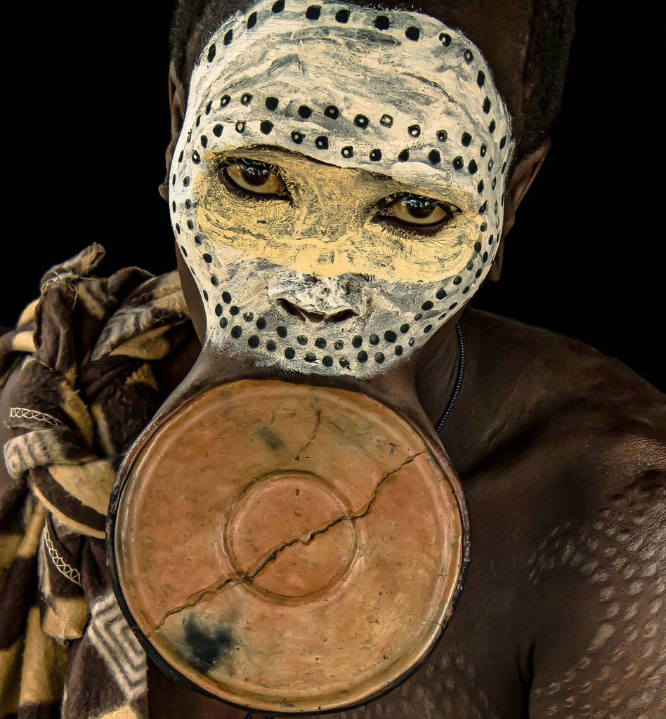 Adornment by Fink is a portrait of a Suri tribeswoman in the Omo Vally of Ethiopia.