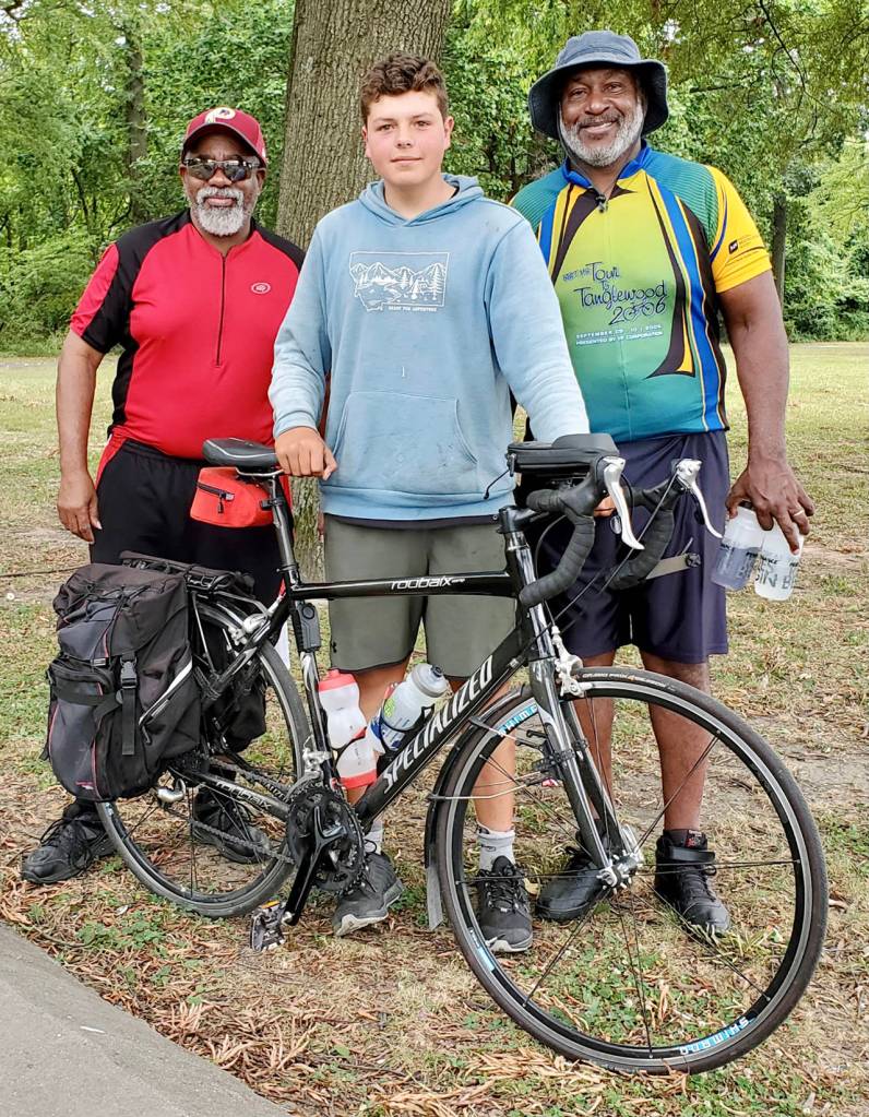 Deven Boyce (center), 14, met many fellow bicyclists along the way. This was in College Park, Maryland. (Submitted photo)