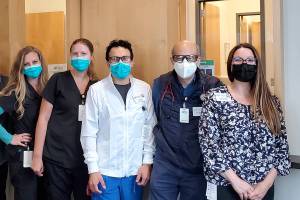 Practice Manager Lydia Alexander with the staff of providers, MAs and receptionists at Community Health Center of Snohomish County's Everett-College Clinic.