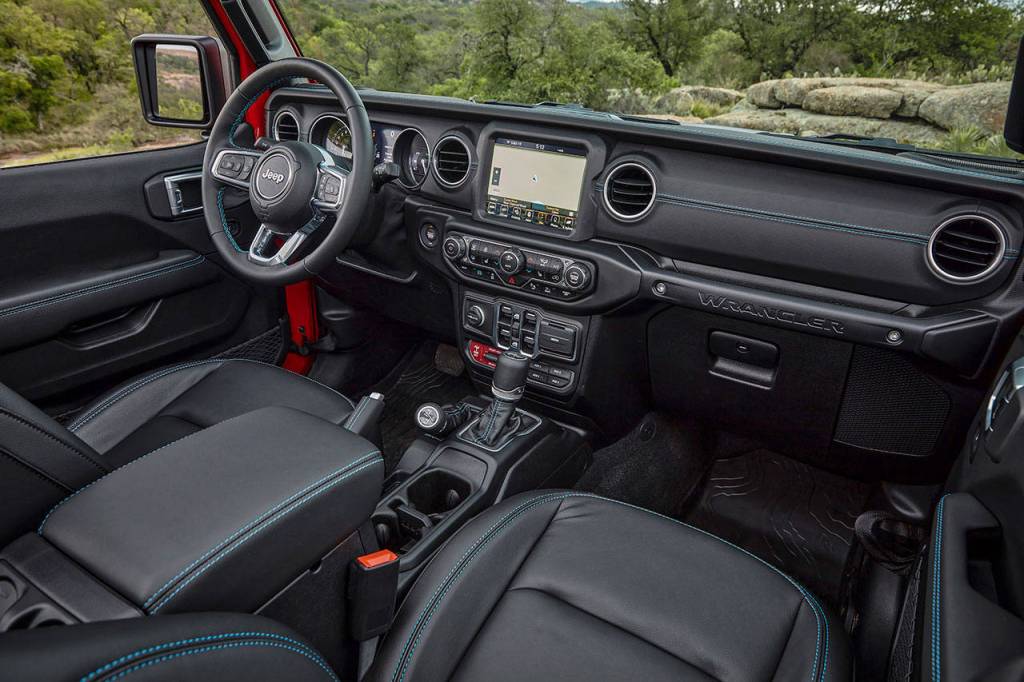 The 2021 Jeep Wrangler 4xe interior shows signs of new tech, but styling is pure Jeep. The Rubicon interior is shown here. (Manufacturer photo)