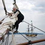 Charlie Drummond of Coupeville crews the Hawaiian Chieftain in Penn Cove, with the Lady Washington in the background. (Photo by David Welton)