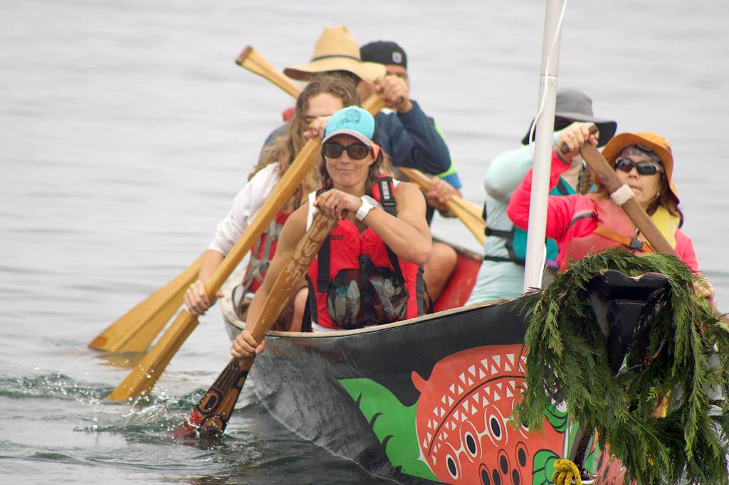 Paddlers begin their two-week journey to Lummi Island with the Blue Heron Canoe Family on Monday morning. (Isabella Breda / The Herald)