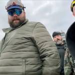 Daniel Scott (in green jacket) and Eddie Block (bottom right) are shown in a video before the Proud Boys and other rioters stormed the U.S. Capitol building on Jan. 6 in Washington, D.C. (YouTube)