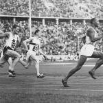 In this 1936 photo, Jesse Owens leads the race during heat 3 of the 200-meter quarterfinal, with Lee Orr (left) of Canada and Karl Neckermann of Germany close behind. (Monroe Historical Society)