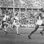In this photo Jesse Owens leads the race during heat 3 of the 200m quarter final. From the left we see Lee Orr of Canada and Karl Neckermann of Germany. (Photo Courtesy of the Monroe Historical Society)