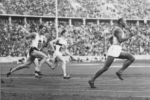 In this photo Jesse Owens leads the race during heat 3 of the 200m quarter final. From the left we see Lee Orr of Canada and Karl Neckermann of Germany. (Photo Courtesy of the Monroe Historical Society)