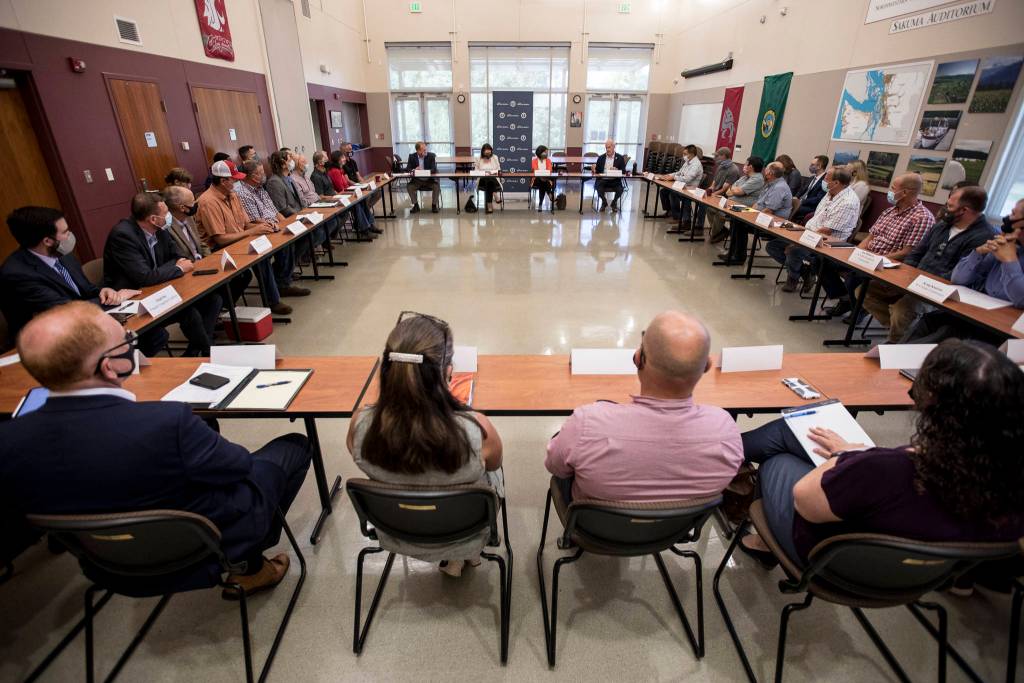 Local farmers and officials meet with U.S. Trade Representative Katherine Tai and U.S. Reps. Suzan DelBene and Rick Larsen in Mount Vernon on Thursday. (Olivia Vanni / The Herald)