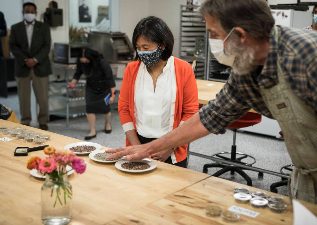 Director Stephan Jones (right) explains to U.S. Trade Representative Katherine Tai how wheat and grain are used at the Washington State University Bread Lab. (Olivia Vanni / The Herald)
