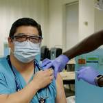 Dr. George Diaz is vaccinated at Providence Regional Medical Center Everett on Friday, Dec. 18, 2020. (Providence)