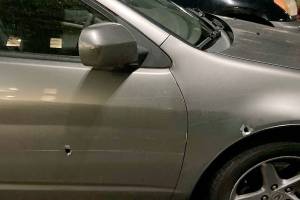 A man was shot Tuesday, Aug. 3, 2021, while driving on I-5 through Lynnwood, according to Washington State Patrol. This is his vehicle, with two bullet holes visible. (Washington State Patrol) 20210804