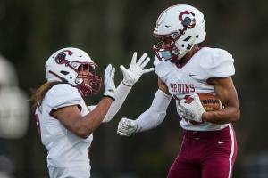 Cascade's Amir Andrews celebrates his touchdown during the game against Kamiak on Thursday, April 1, 2021 in Everett, Wa. (Olivia Vanni / The Herald)