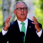 Gov. Jay Inslee speaks at a news conference Monday in Seattle, where he announces a COVID-19 vaccine mandate for Washington state employees and health-care workers. (Ken Lambert/The Seattle Times via AP)