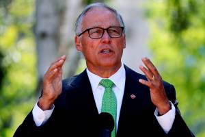 Gov. Jay Inslee speaks at a news conference where he announces COVID-19 vaccine mandate for Washington state employees and health-care workers, Monday, Aug. 9, 2021 in Seattle. (Ken Lambert/The Seattle Times via AP)