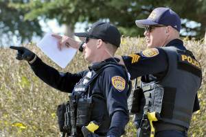 Police investigate a shooting at the corner of Rucker and Everett avenues April 10 2020. (Sue Misao / The Herald)