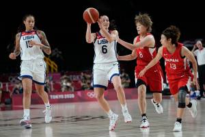 United States' Sue Bird (6) drives past Japan's Maki Takada (8) and Rui Machida (13), right, during women's basketball gold medal game at the 2020 Summer Olympics, Sunday, Aug. 8, 2021, in Saitama, Japan. (AP Photo/Eric Gay)