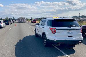 Troopers respond to the scene of a vehicle vs. motorcycle collision on I-5 near 12th St. on Sunday afternoon. (Washington State Patrol)