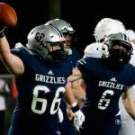Glacier Peak's Adam Troxel celebrates a fumble recovery with teammate Jackson Hawkins at Veterans Memorial Stadium Friday night in Snohomish on March 12, 2021. (Kevin Clark / The Herald)