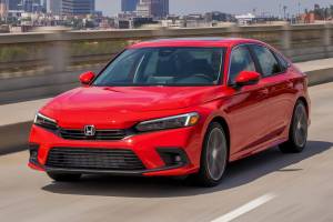 The 2022 Honda Civic Sedan Touring model has a 180-horsepower turbocharged four-cylinder engine joined to a CVT automatic transmission. (Honda) 20210816