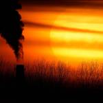 FILE - In this Monday, Feb. 1, 2021 file photo, emissions from a coal-fired power plant are silhouetted against the setting sun in Independence, Mo. A United Nations report released on Thursday, Feb. 18, 2021 says humans are making Earth a broken and increasingly unlivable planet through climate change, biodiversity loss and pollution. So the world must make dramatic changes to society, economics and daily life. (AP Photo/Charlie Riedel)