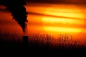 FILE - In this Monday, Feb. 1, 2021 file photo, emissions from a coal-fired power plant are silhouetted against the setting sun in Independence, Mo. A United Nations report released on Thursday, Feb. 18, 2021 says humans are making Earth a broken and increasingly unlivable planet through climate change, biodiversity loss and pollution. So the world must make dramatic changes to society, economics and daily life. (AP Photo/Charlie Riedel)