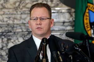 State Superintendent of Public Instruction Chris Reykdal talks to the media about the decision to close schools in three counties in response to COVID-19, Thursday, March 12, 2020, in Olympia, Wash. All public and private K-12 schools in King, Pierce and Snohomish counties will be closed for six weeks, and Gov. Jay Inslee said there could be closures in more counties soon. (AP Photo/Rachel La Corte)