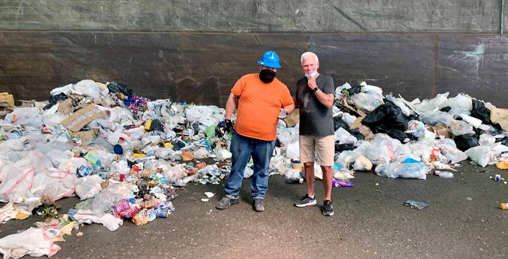 Neal Baum with Solid Waste maintenance technician Jack Lockhart after the diamond bracelets were found in the trash. (Contributed photo)