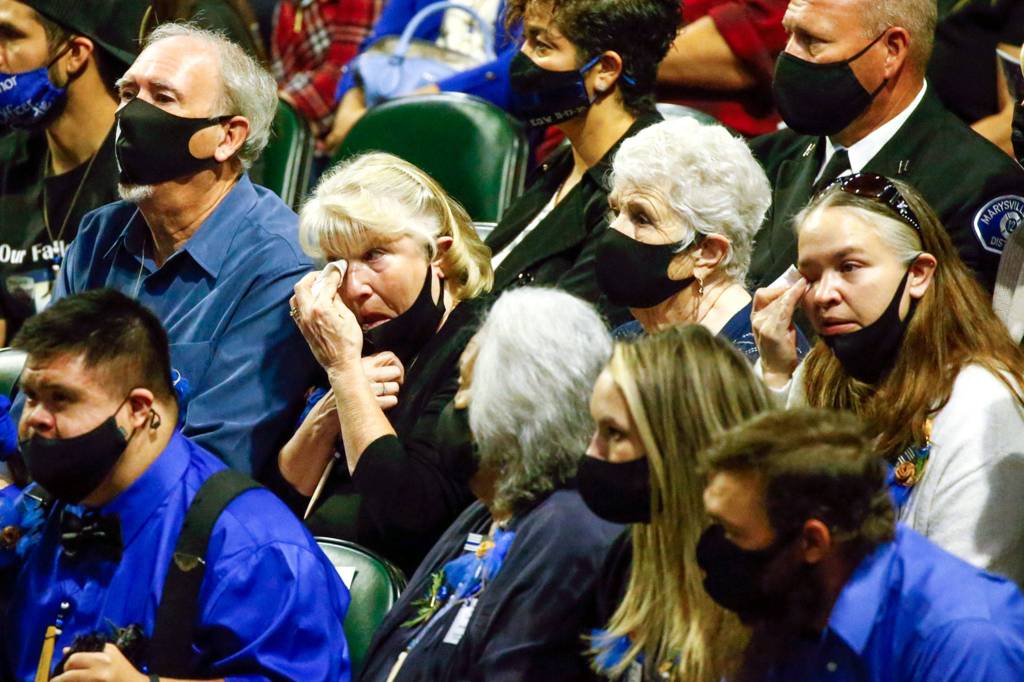 Friends and family at the memorial service for Officer Charlie Joe Cortez on Tuesday at Angel of the Winds Arena in Everett. (Kevin Clark / The Herald)