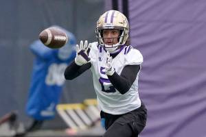 Washington defensive back Kyler Gordon makes a catch during the first day of NCAA college football practice for the team Wednesday, April 7, 2021, in Seattle. (AP Photo/Ted S. Warren)