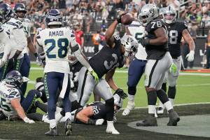 Las Vegas Raiders running back Trey Ragas (36) celebrates after scoring a touchdown against the Seattle Seahawks during the first half of an NFL preseason football game, Saturday, Aug. 14, 2021, in Las Vegas. (AP Photo/Rick Scuteri)