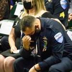 An attendee reacts to the program during the memorial service for Officer Charlie Joe Cortez Tuesday afternoon at the Angel of the Winds Arena in Everett on August 17, 2021.  (Kevin Clark / The Herald)