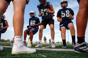 Players run through drills during practice Wednesday afternoon at Glacier Peak High School in Snohomish on August 18, 2021.  (Kevin Clark / The Herald)