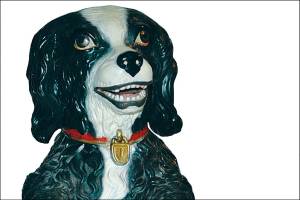 The terra cotta tobacco jar by Jon Maresch, shaped like a smiling black dog, is marked JM#116 and sold at Fox Auctions for $240. (Cowles Syndicate Inc.)