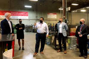 From left, U.S. Rep. Rick Larsen, D-Everett; Everett Community College President Daria Willis; Herman Calzadillas, dean of the college’s Advanced Manufacturing Training and Education Center; Brandon Anderson, legislative director for the Society of Professional Engineering Employees in Aerospace; and Elliott Black, director of U.S. Department of Transportation’s Aviation Manufacturing Jobs Protection Program. They were touring the Advanced Manufacturing Center at EvCC on Friday. (Janice Podsada / The Herald) 20210820