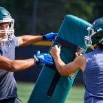 Jacob Sanchez (left) works to get around George Quintans during practice Thursday afternoon at Edmonds-Woodway High School in Edmonds. (Kevin Clark / The Herald)