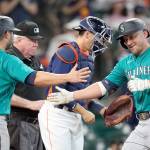 Seattle Mariners Kyle Seager, right, celebrates with Ty France (23) after both scored on Seagers three-run home run against the Houston Astros during the 11th inning of a game Sunday in Houston. (AP Photo/David J. Phillip)