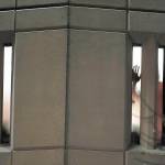A person holds a hand up to a window inside the Pierce County Jail on Jan. 24 in downtown Tacoma. (AP Photo/Ted S. Warren, file)
