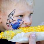 Lincoln Pillar enjoys corn on the cob on at the Evergreen State Fair in 2016. (Kevin Clark / Herald file)
