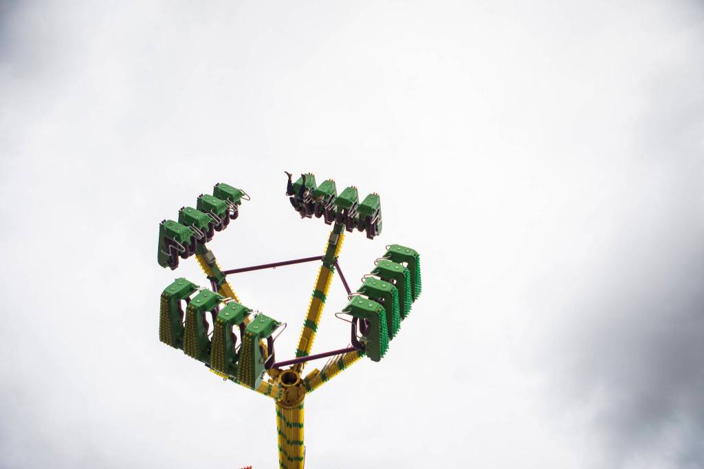 People enjoy the Freak Out ride during opening day of the Evergreen State Fair on Thursday in Monroe. (Olivia Vanni / The Herald)
