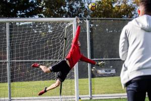 Cameron Beardsley dives for a ball during practice on Tuesday, Oct. 8, 2019 in Everett, Wash. (Olivia Vanni / The Herald)