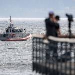 A boat patrols the area of a downed airplane in Edmonds on August 26, 2021. (Kevin Clark / The Herald)